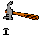 a hammer pounding into a nail