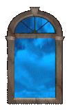 a window showing a blue cloudy sky